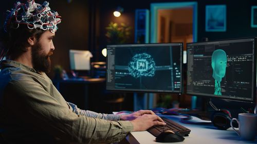 Rear view of man working in office