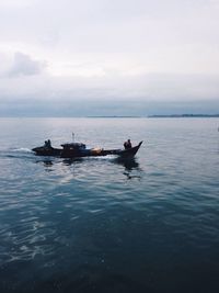 Boat sailing in sea