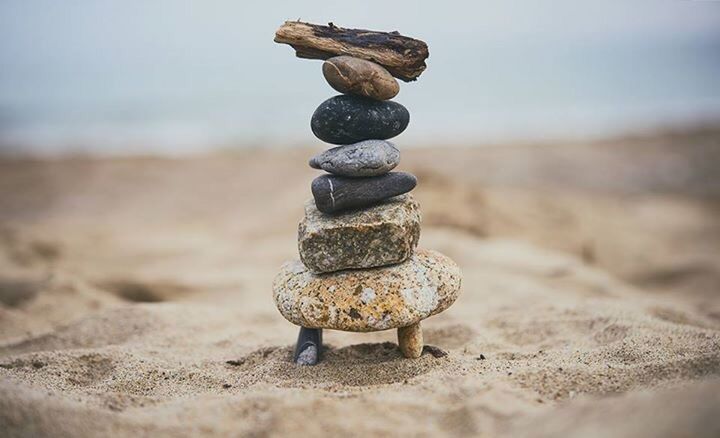 CLOSE-UP OF STACK OF PEBBLES