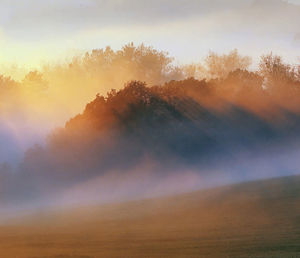 Scenic view of landscape against sky at morning