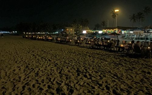 View of illuminated street lights at night