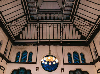 Low angle view of chandelier hanging from ceiling