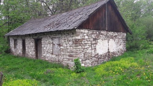 Abandoned house on field