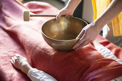 Close-up of hand holding bowl