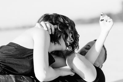 Portrait of woman relaxing on beach