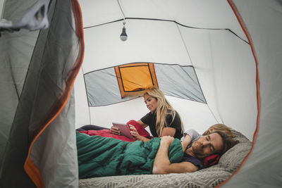 People relaxing on bed