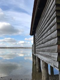 Pier over lake against sky