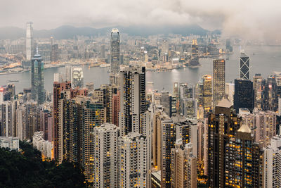 Aerial view of modern buildings in city against sky