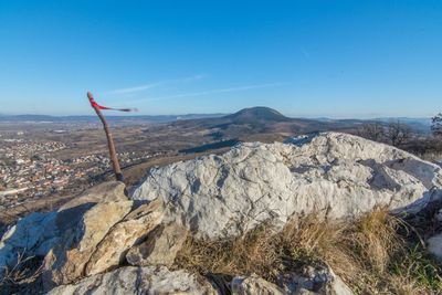 Scenic view of mountains against clear blue sky