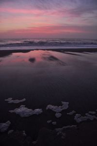 Scenic view of sea at sunset