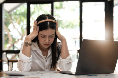 Businesswoman working at desk in office