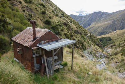 Built structure on landscape against sky