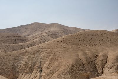 Scenic view of desert against clear sky