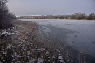 Scenic view of frozen lake against sky