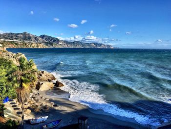 Scenic view of sea against blue sky