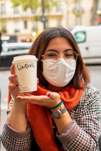 Portrait of woman holding a coffee cup