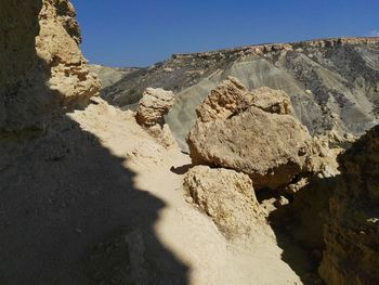 Scenic view of desert against clear sky
