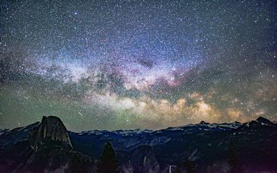 Scenic view of mountains against sky at night