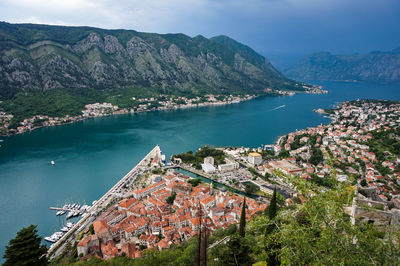 High angle view of townscape by sea