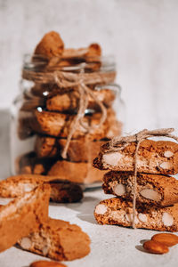 Traditional italian cantuccini cookies with almonds in glass jar. sweet dried biscuits. homemade 