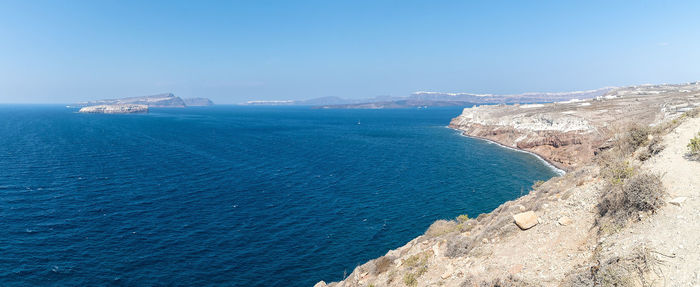 Scenic view of sea against blue sky