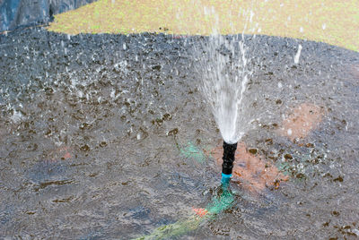 High angle view of water flowing through pipe