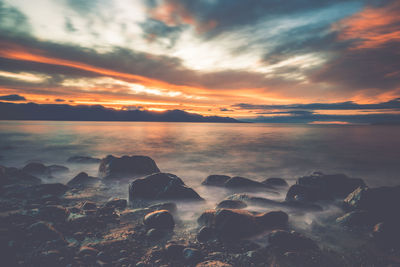 Scenic view of sea against dramatic sky