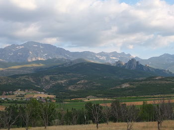 Scenic view of landscape and mountains against sky