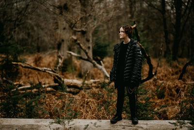 Full length of woman standing on rock