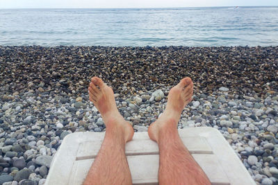 Low section of person on beach