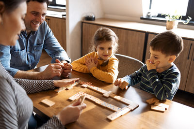 Boy playing with toy blocks at home