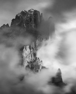 View of rock formation on land against sky