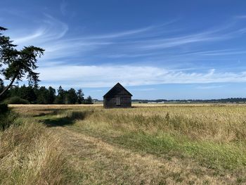 House on field against sky