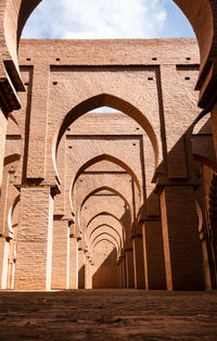 Low angle view of historical mosque building against sky