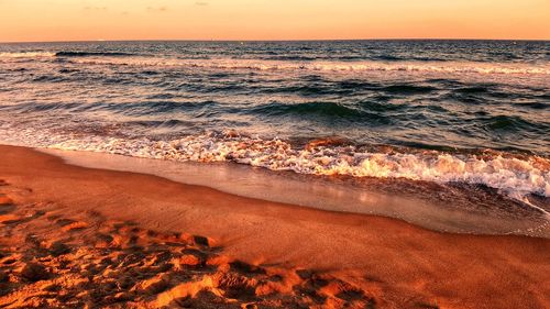 Scenic view of sea against sky during sunset