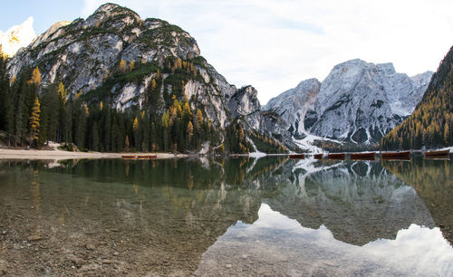 Scenic view of lake and mountains against sky