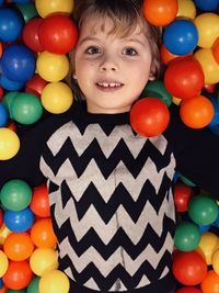 Portrait of smiling boy in ball pool