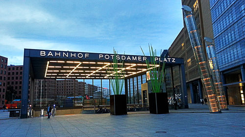 Information sign in city against sky