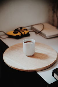 Close-up of coffee cup on table