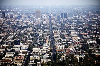 High angle view of modern buildings in city against sky