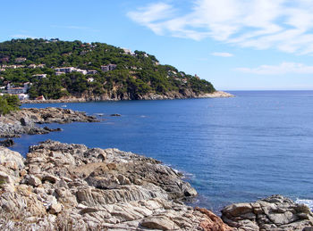 View of calm sea against cloudy sky