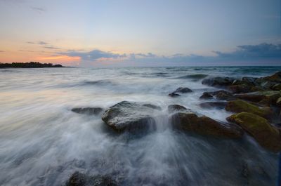 Scenic view of sea against sky during sunset