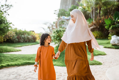 Sisters walking in park