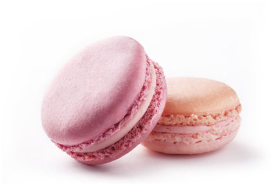 Close-up of pink cake against white background