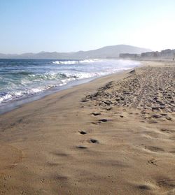 Scenic view of beach against sky