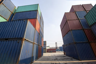 Row of stacking containers of freight import-export distribution logistics transport industrial.