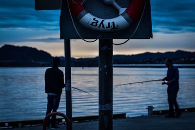 Man on sea against sky