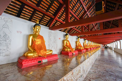 Statues of buddha in temple building