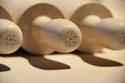 Close-up of rolling pins on table