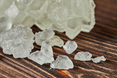 Crystalline sugar lying on vintage wooden background